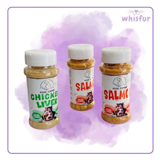 Three jars of pet food toppers with labels for chicken liver, salmon, and salmon on a purple background, branded 'whisfur'.