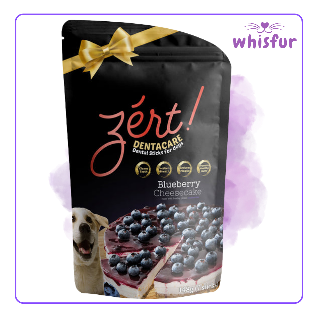 Zért! Dentacare Blueberry Cheesecake dental sticks packaging for dogs with a gold bow on a white background, branded 'whisfur'.