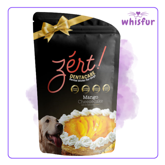 Packaging of zért! Dentacare Mango Cheesecake dental sticks for dogs with a gold bow on a black background, branded 'whisfur'.